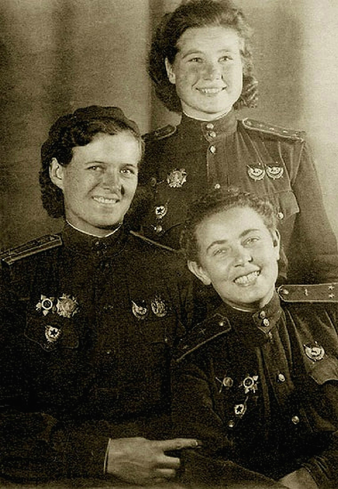 Major Yevdokiya Bershanskaya with navigators Polina Gelman and Katya Smirnova of the Soviet Night Witches regiment