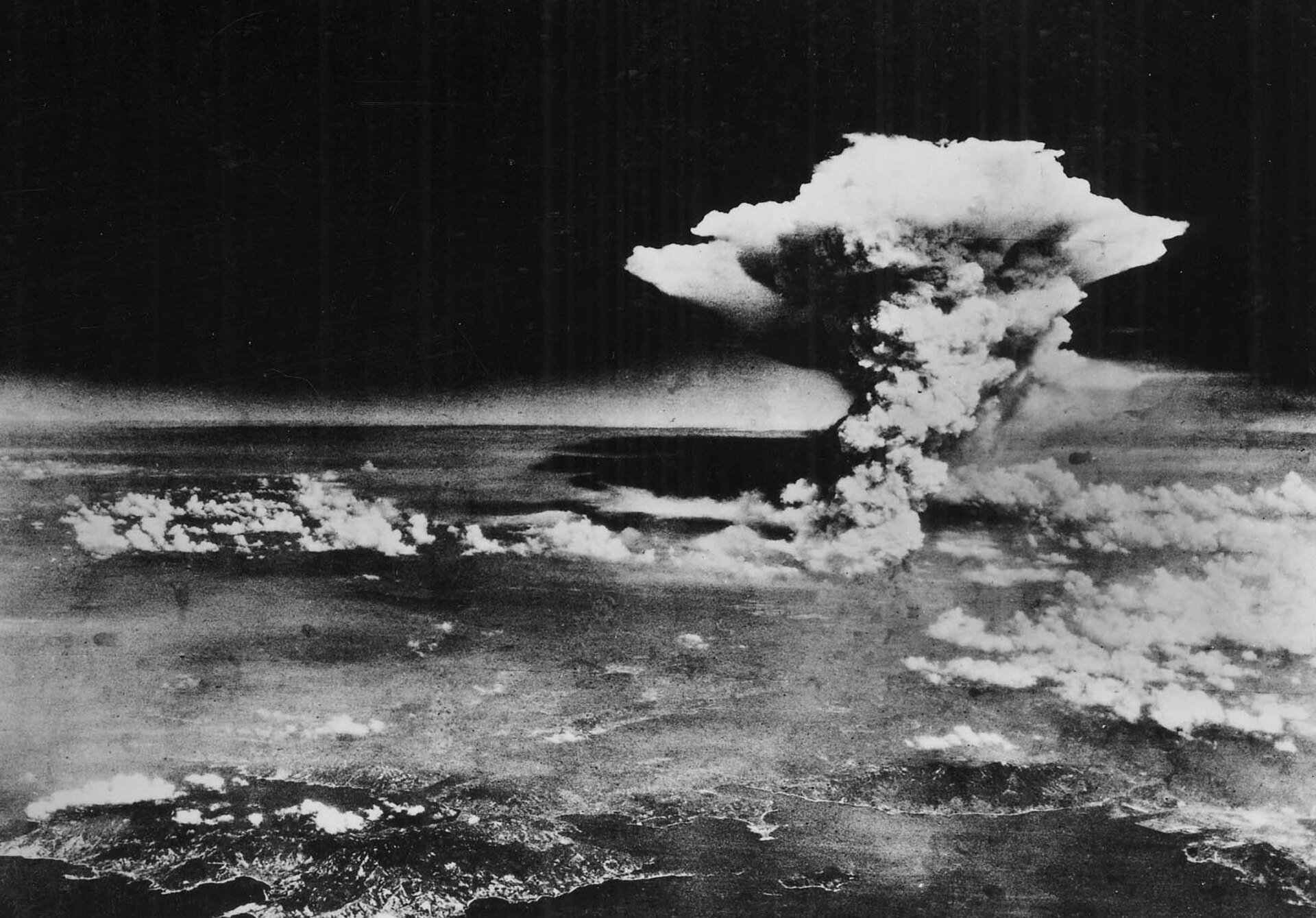 The atomic cloud rising over Hiroshima, 6 August 1945