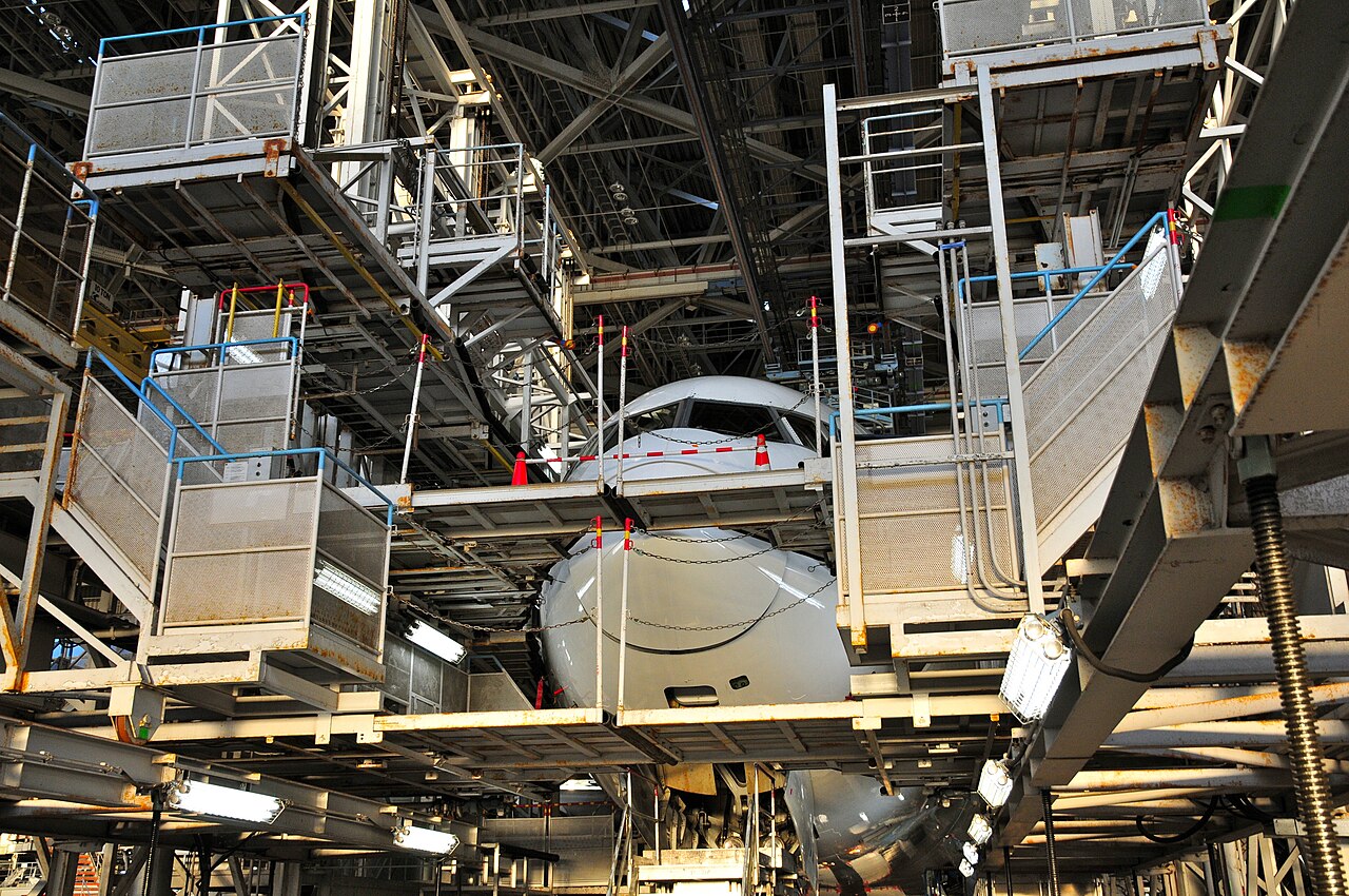 A Boeing 777 undergoing maintenance in a hangar