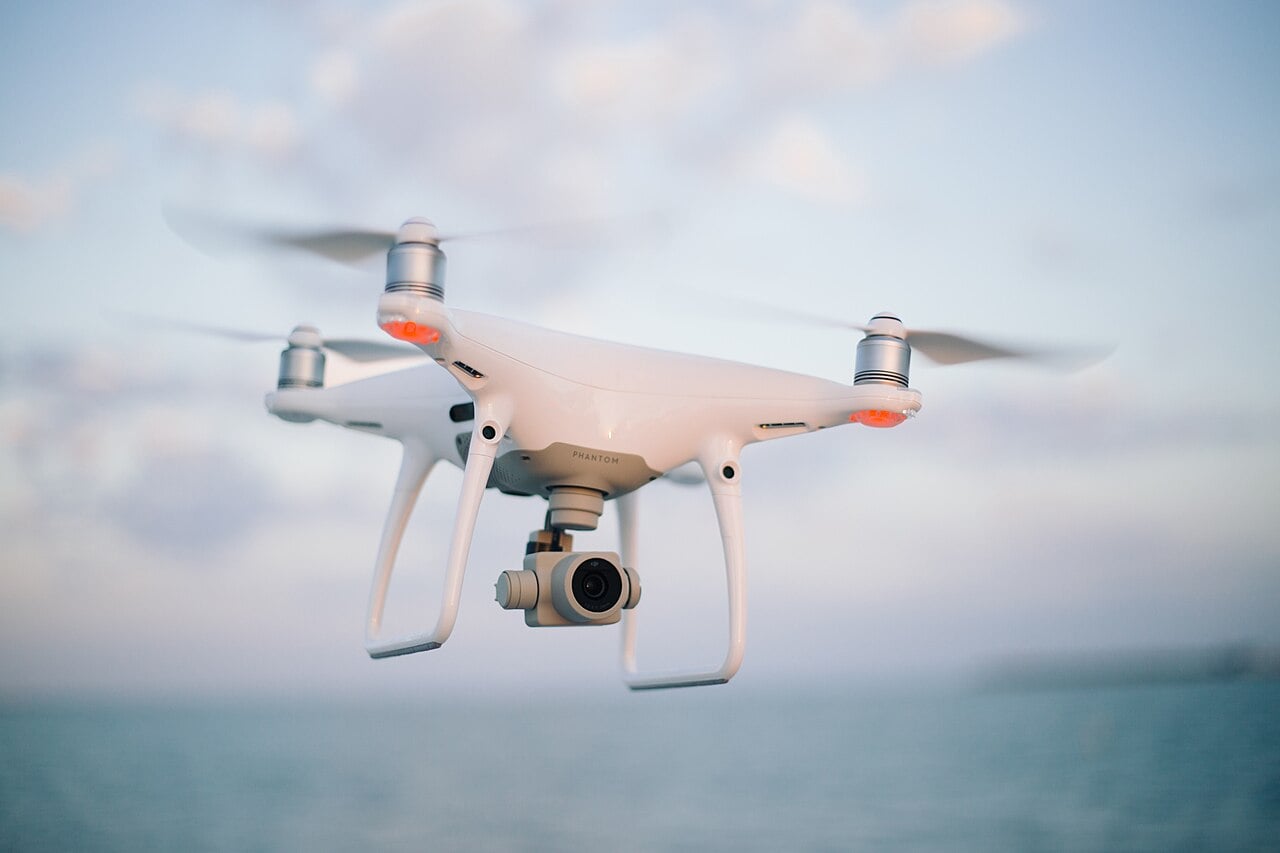 A consumer quadcopter camera drone in flight