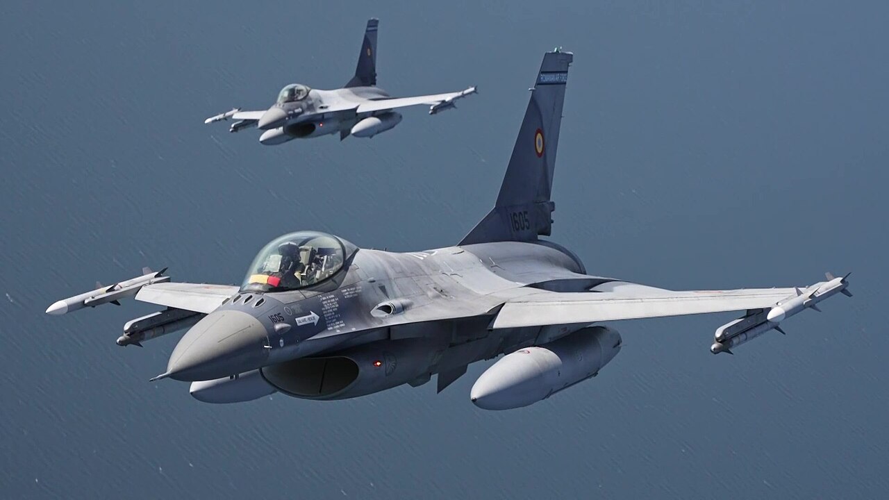 Two Romanian Air Force F-16 Fighting Falcons fly over the Baltic Sea on NATO Baltic Air Policing
