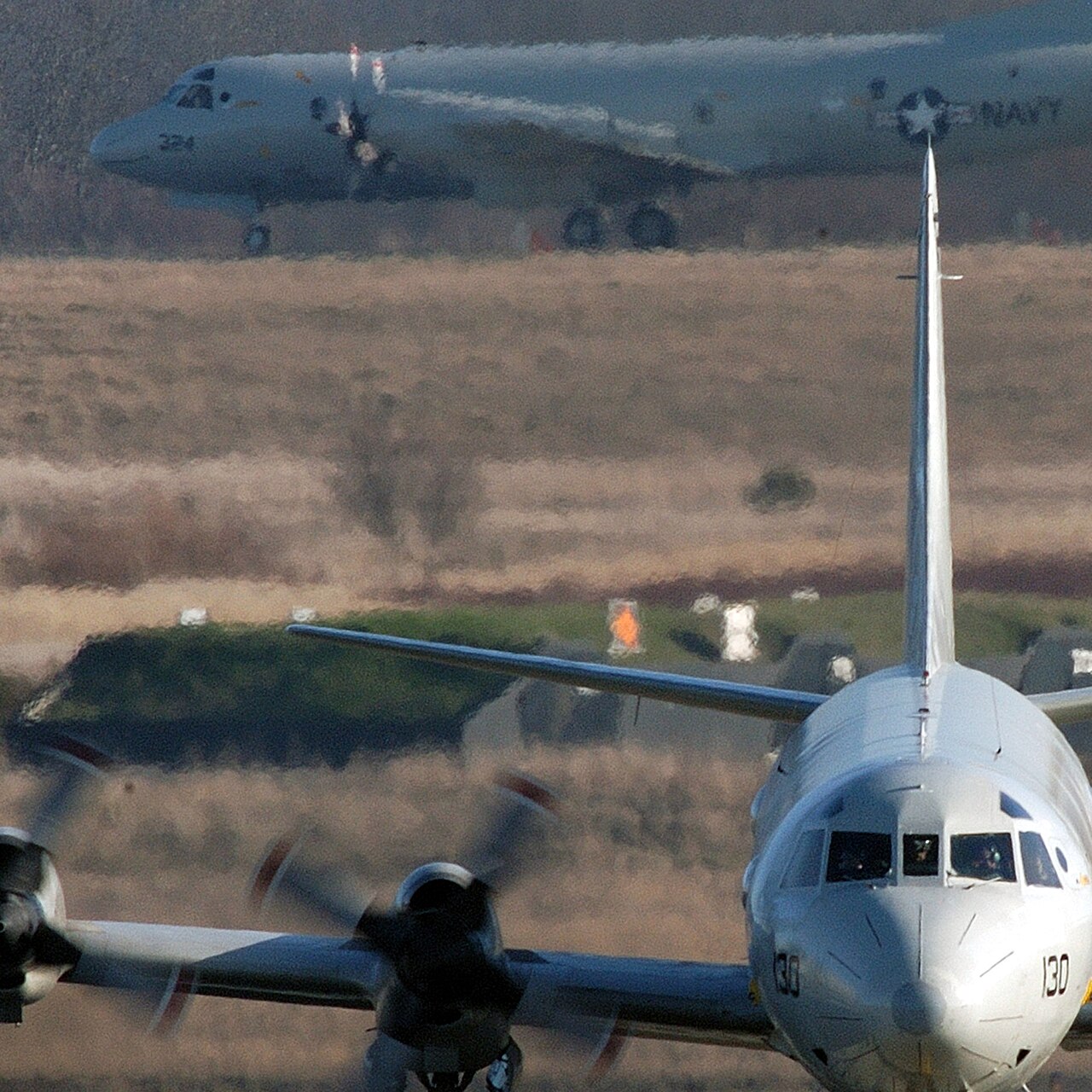 Two P-3 Orion maritime patrol aircraft on the tarmac