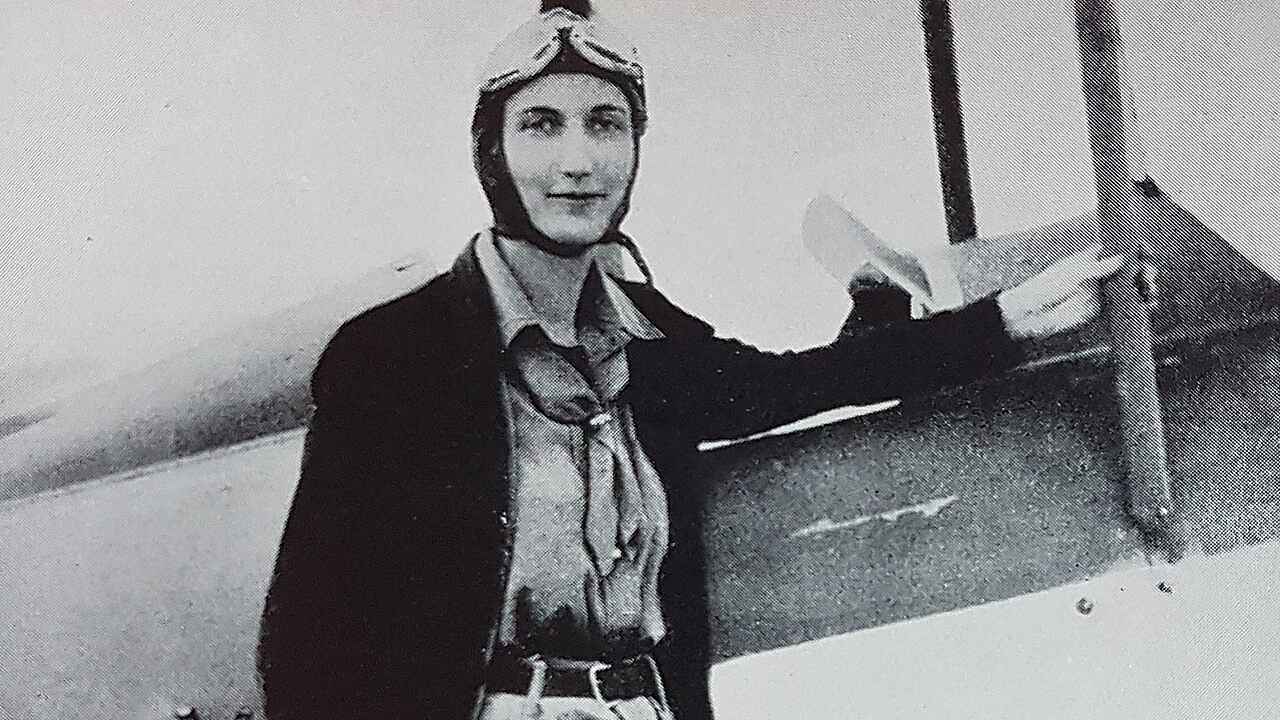 Beryl Markham in flying gear beside her aircraft before her 1936 Atlantic flight