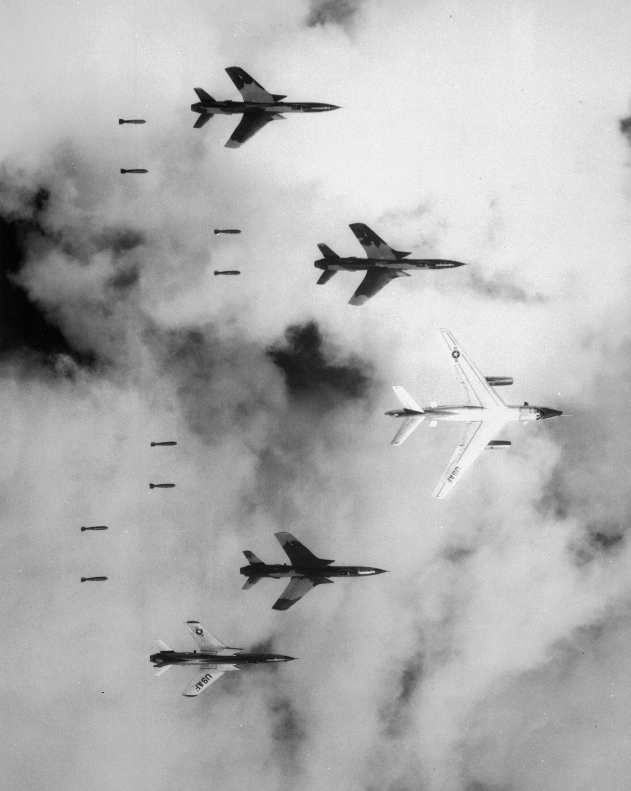 F-105 Thunderchiefs bombing through clouds under radar control of a B-66 Destroyer over North Vietnam