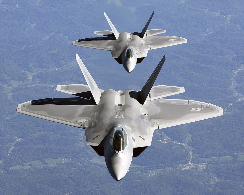 F-22 Raptor: The Winner America Stopped Building A pair of USAF F-22A Raptors in column flight — the fighter that won the ATF competition. U.S. Air Force photo
