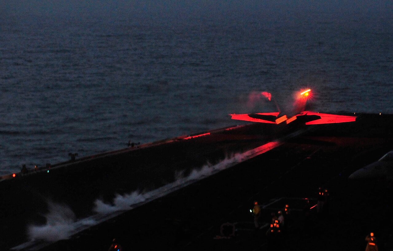 F/A-18F Super Hornet launches from a carrier during night operations