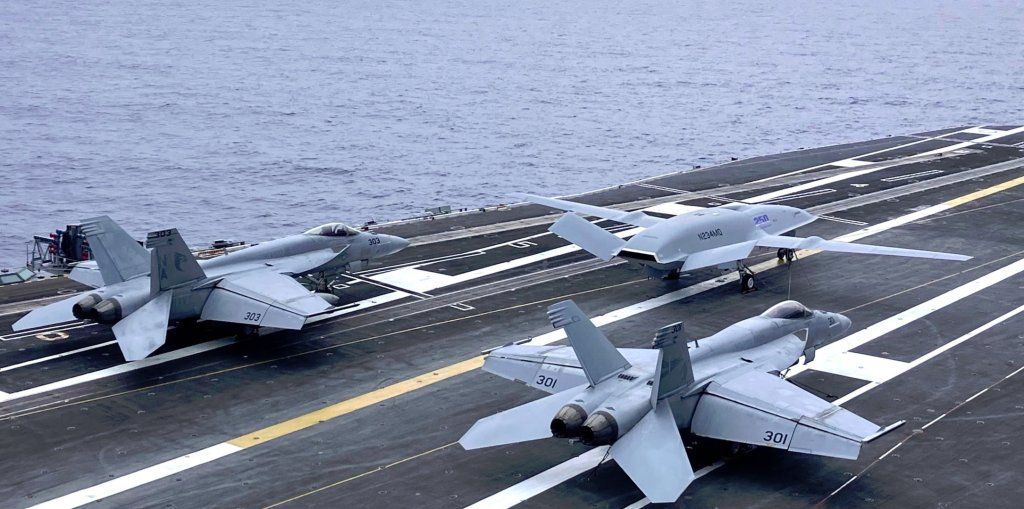 The MQ-25 T-1 demonstrator with 250th anniversary markings on the deck of USS Nimitz