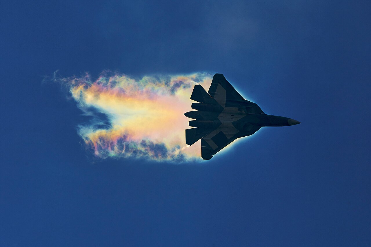 Su-57 pulling a high-G turn with a vapour cone
