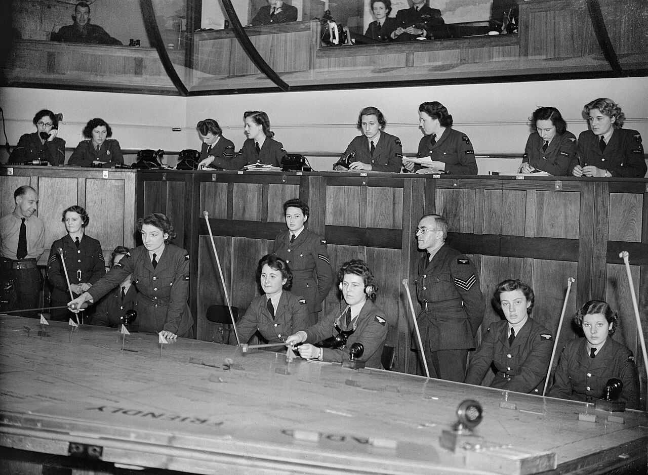 WAAF plotters at work around the map table in the Operations Room at No. 11 Group HQ, Uxbridge