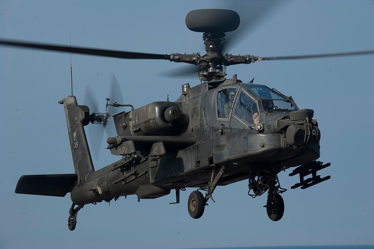US Army AH-64 Apache approaching an amphibious assault ship flight deck