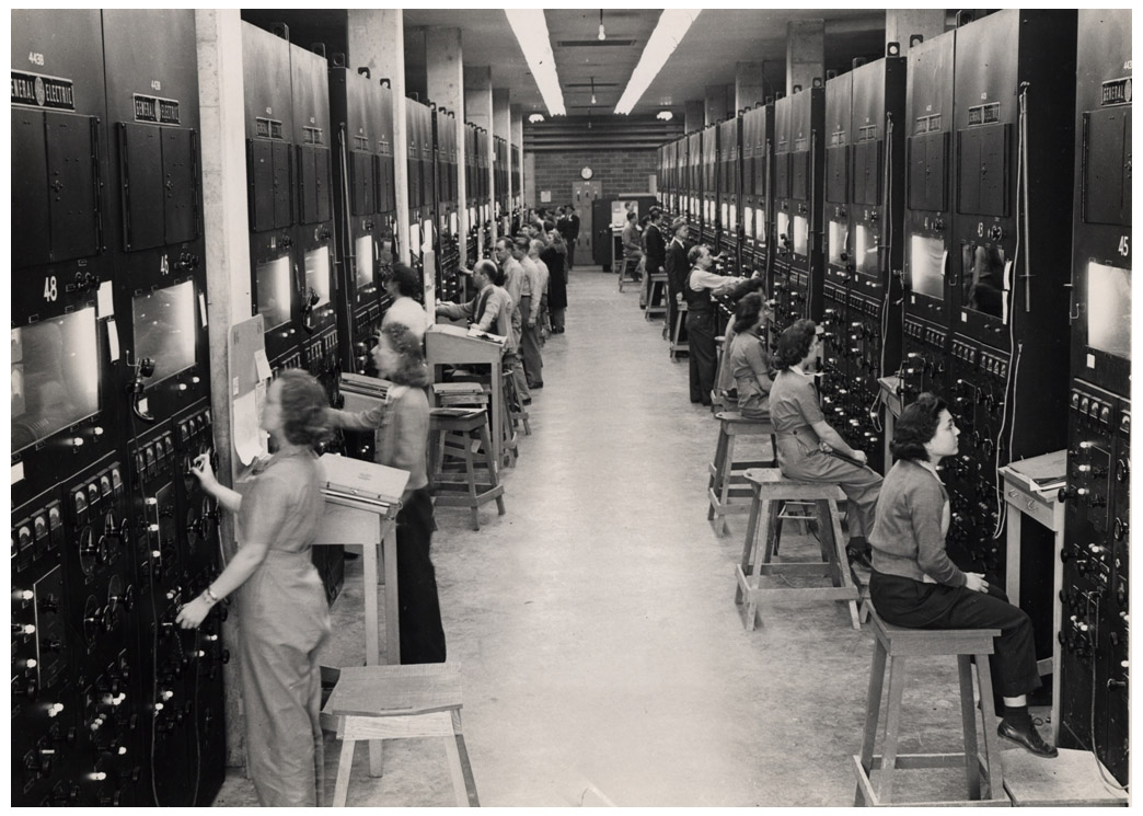 Calutron operators at their panels at Y-12, Oak Ridge
