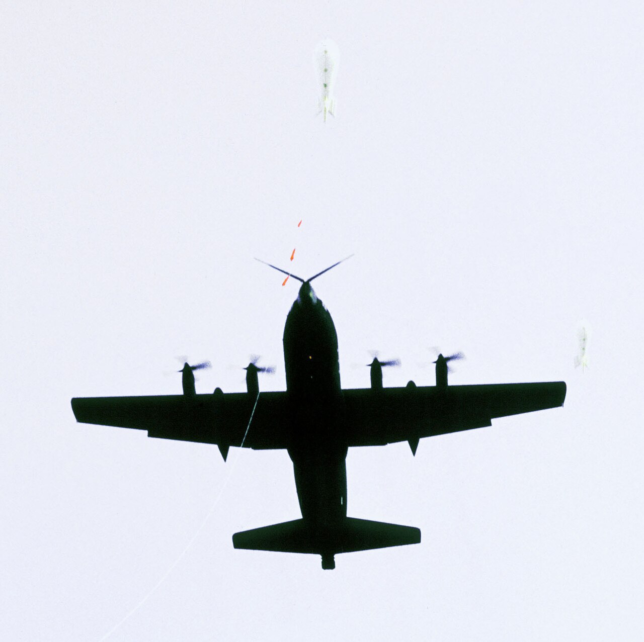An air-to-ground view of an MC-130 Hercules aircraft from the 8th Special Operations Squadron (8th SOS) demonstrating the Fulton Aerial Recovery System DF-ST-83-10609 cropped.JPEG