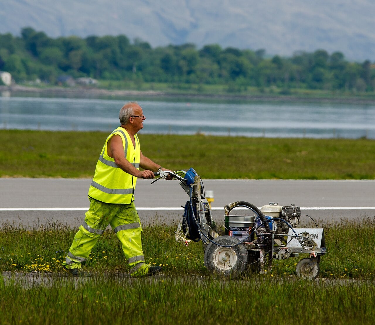 Ground crew painting runway markings