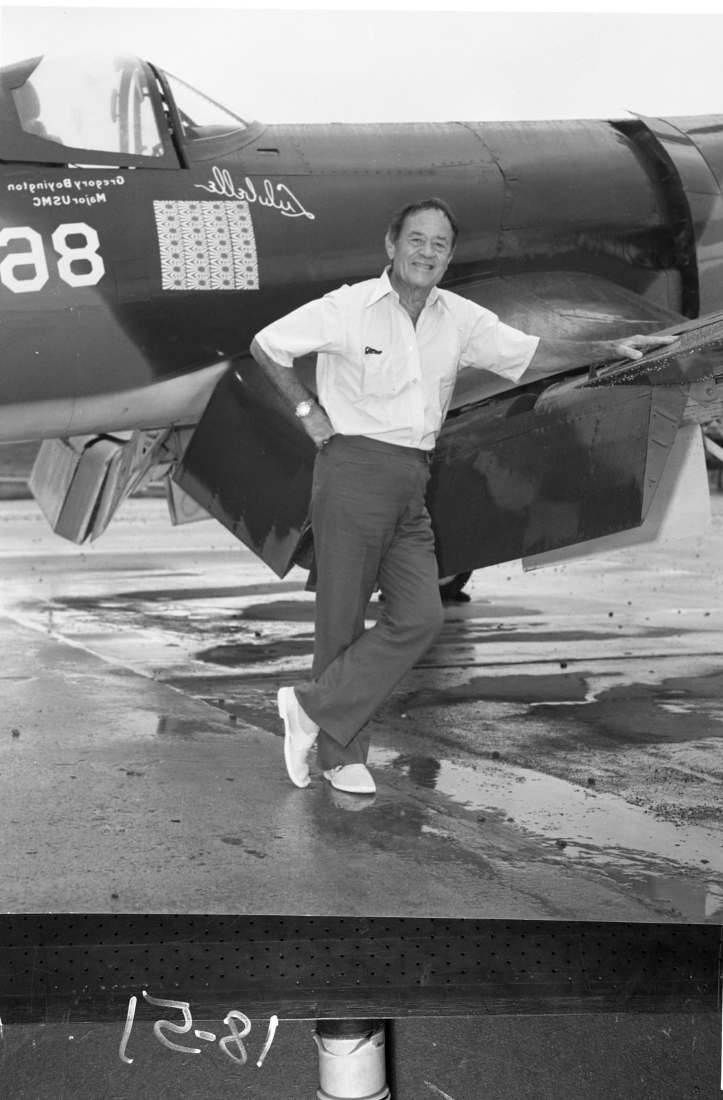 Pappy Boyington beside an F4U Corsair