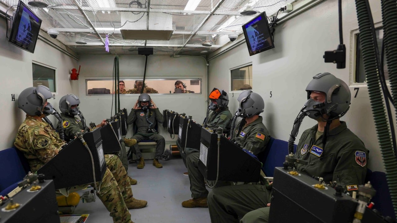 Aircrew students on supplemental oxygen inside the altitude chamber at Beale Air Force Base