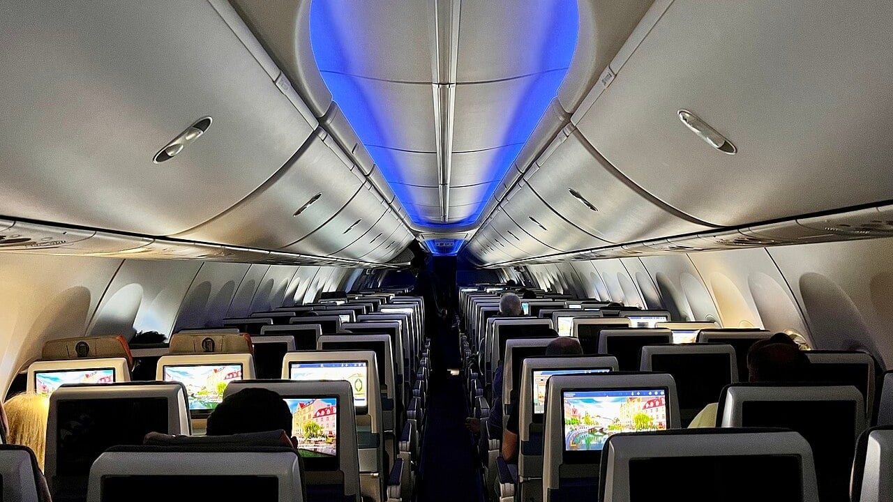 flydubai Boeing 737 MAX 8 cabin looking forward The cabin of a flydubai Boeing 737 MAX 8 looking forward along the aisle towards the cockpit
