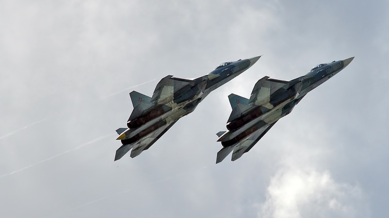 A pair of Russian Aerospace Forces Su-57 fighters Two Sukhoi Su-57 fighters of the Russian Aerospace Forces flying in close formation