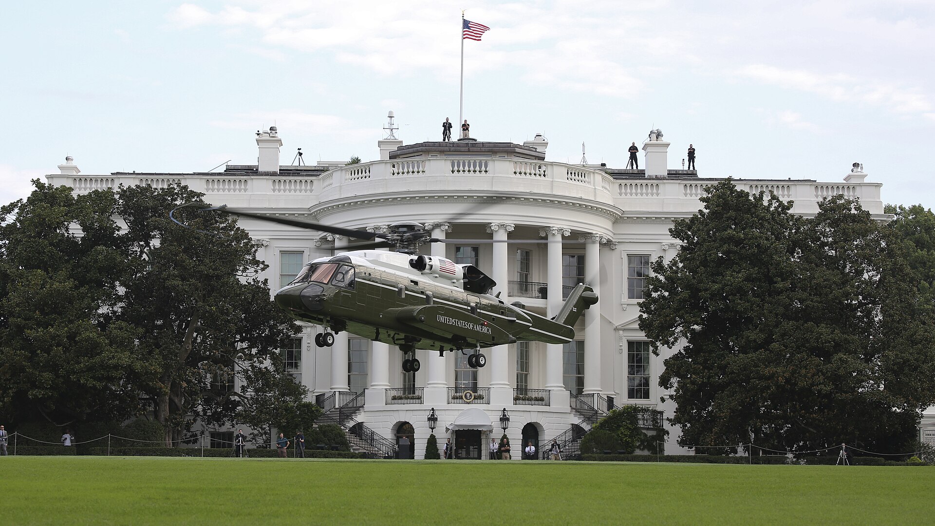 A Sikorsky VH-92 presidential helicopter hovering above the White House South Lawn