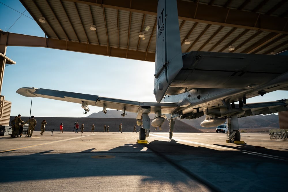 An A-10 Thunderbolt II under a sun shelter at Nellis Air Force Base
