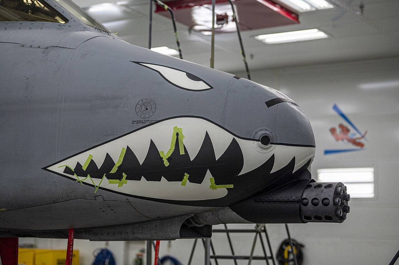 An A-10C Thunderbolt II of the 23rd Wing receiving its shark mouth nose art during a repaint at Moody Air Force Base