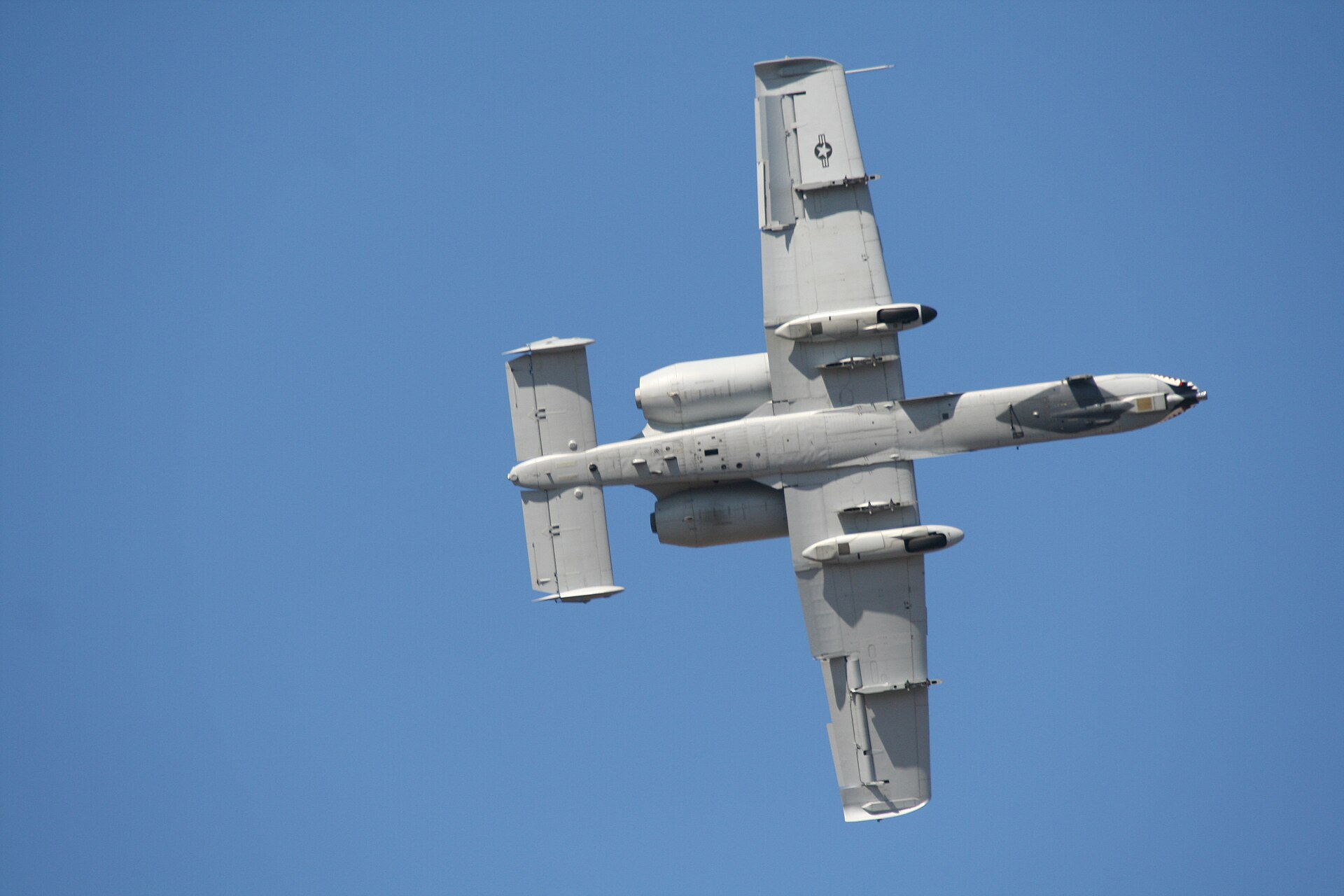 An A-10C Thunderbolt II seen from below in a banking turn