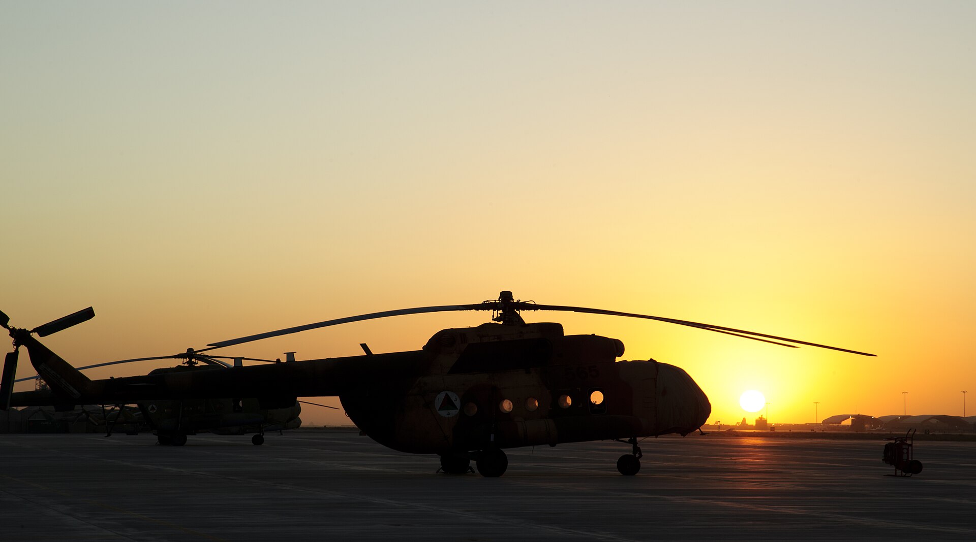 Afghan Air Force Mi-17 helicopters at sunset at Kandahar Airfield