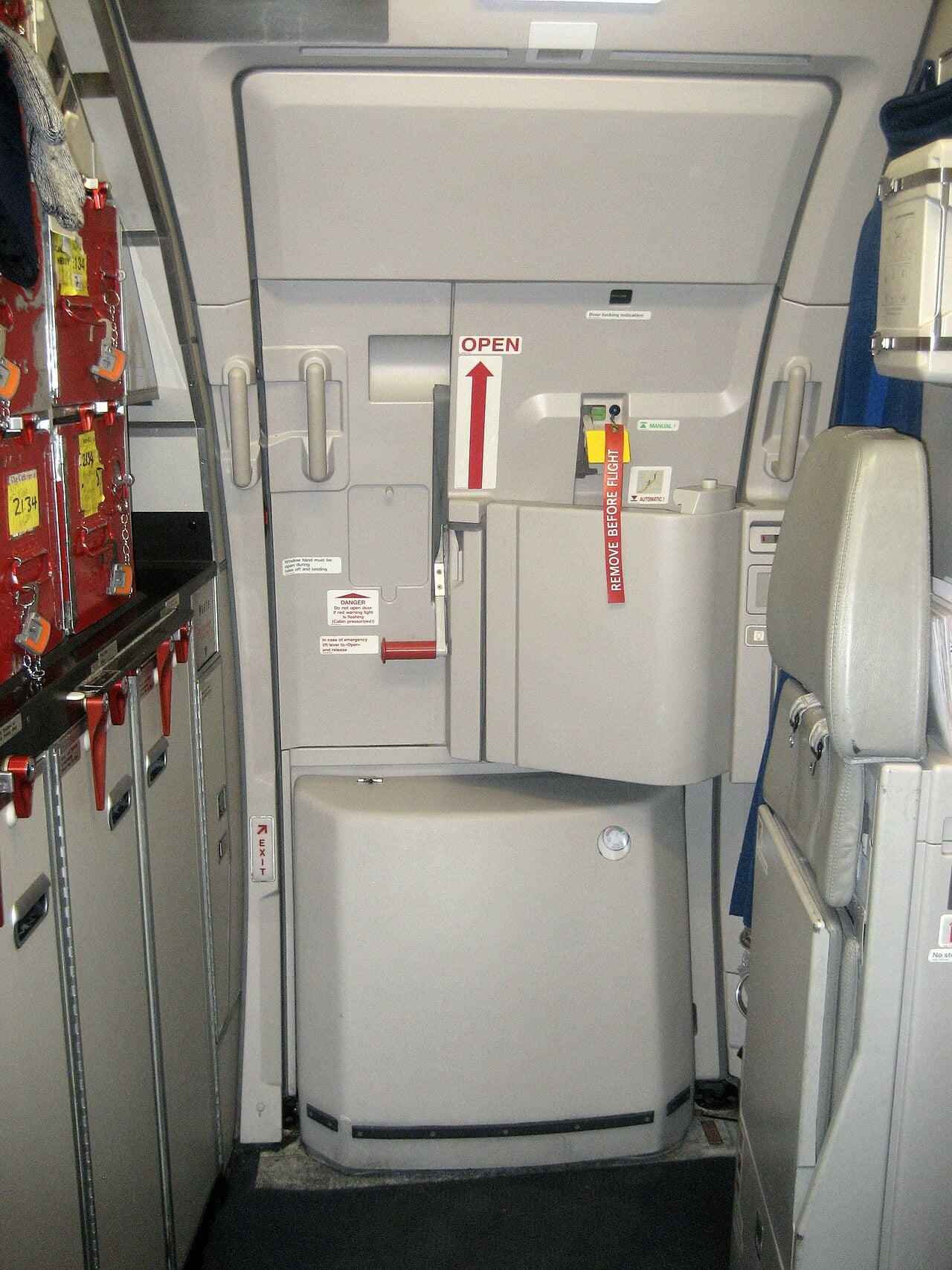Door 2L of an easyJet Airbus A320 showing the escape slide bustle and the door arming lever