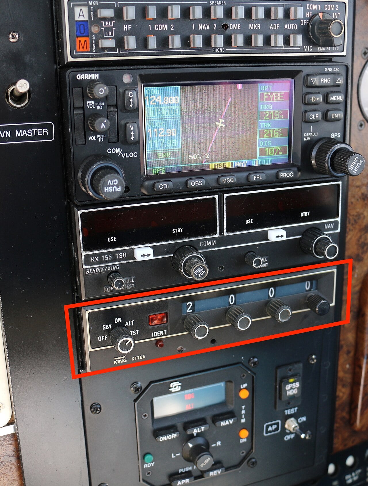 A light aircraft transponder set to code 2000 in a cockpit avionics stack