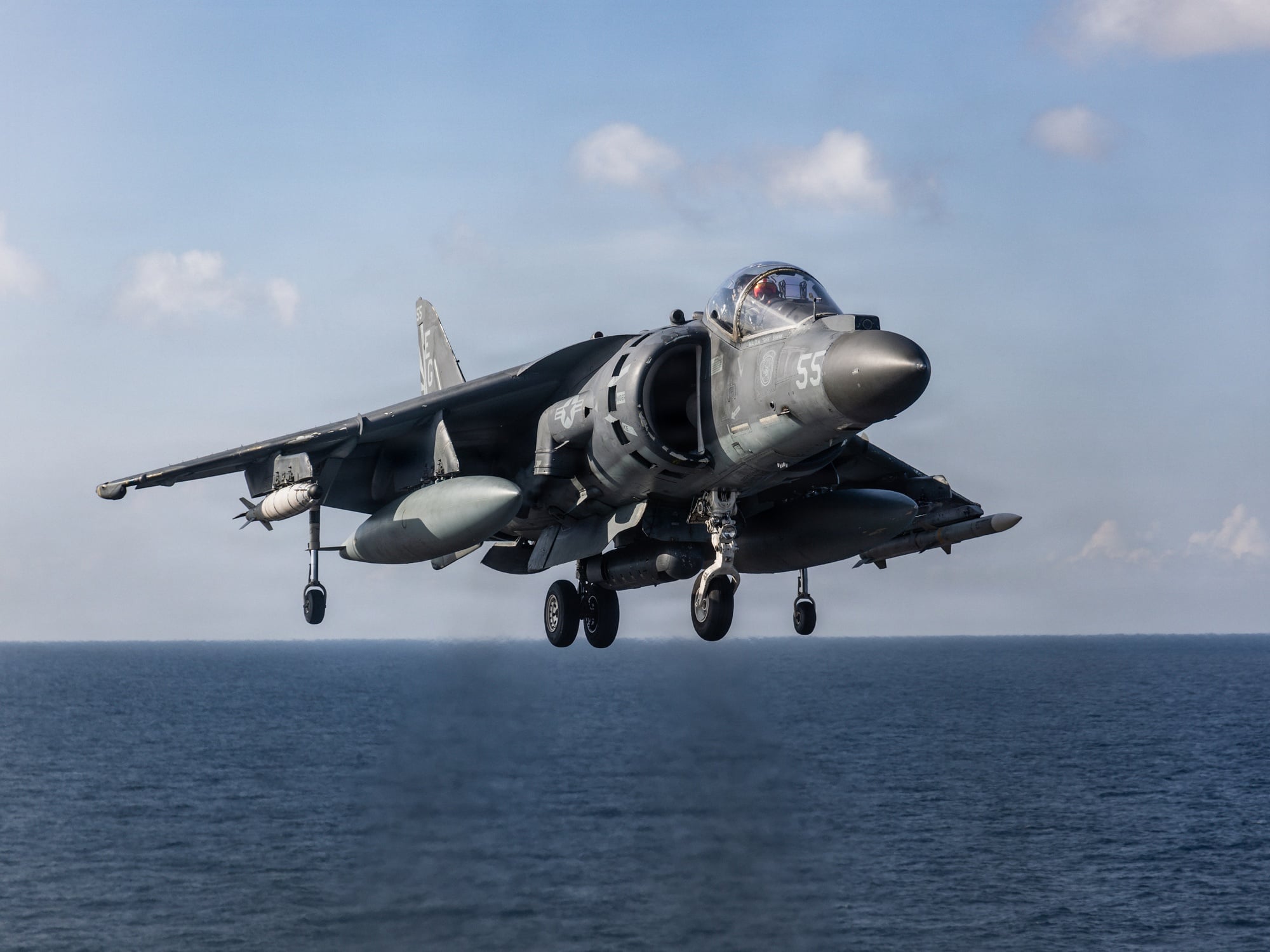 An AV-8B Harrier II preparing to land aboard USS Iwo Jima