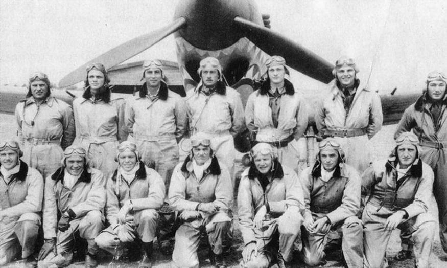 Pilots of the AVG 2nd Squadron, the Panda Bears, posing in front of a P-40
