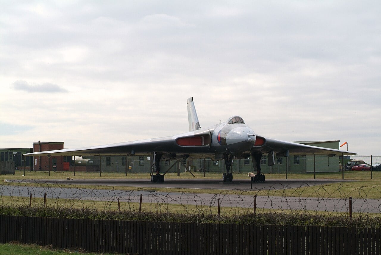 Avro Vulcan B2 XM607 preserved at RAF Waddington behind a perimeter fence