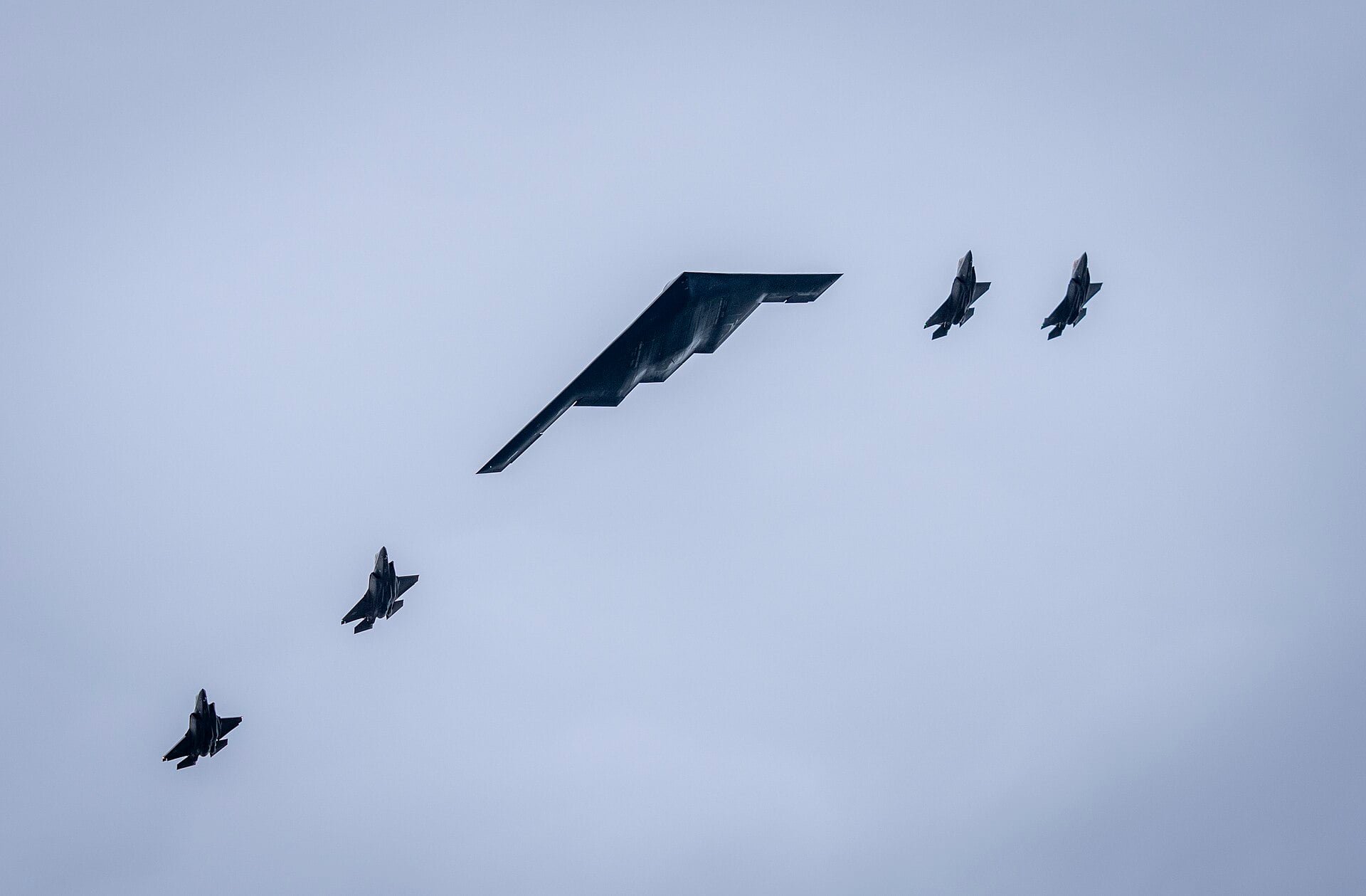 A B-2 Spirit and four F-35s fly over Joint Base Elmendorf-Richardson as Trump welcomed Putin on 15 August 2025