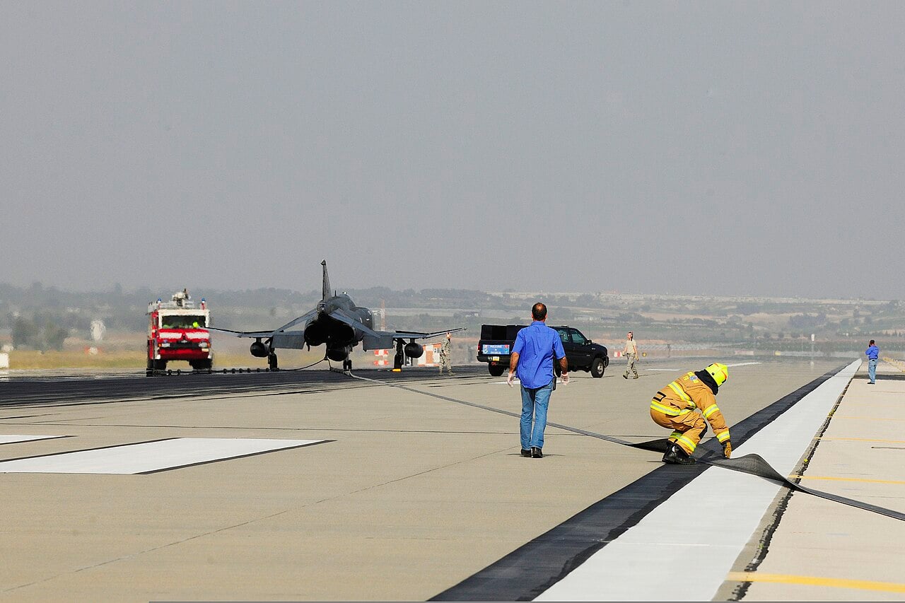Arresting system tape on the runway after an engagement