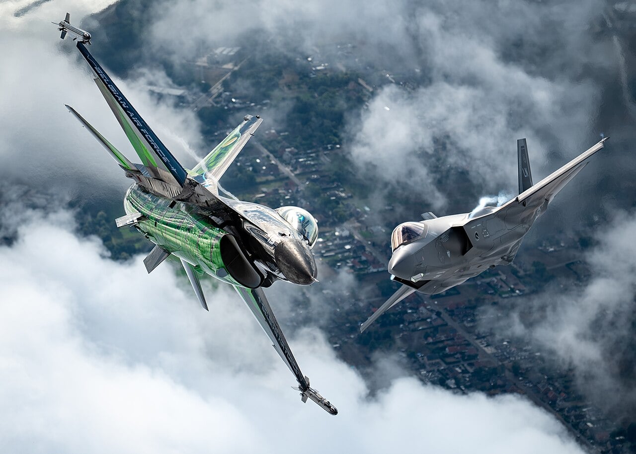 Belgian F-16 solo display with F-35A Belgian Air Component F-16 solo display jet flying in formation with a USAF F-35A over Belgium