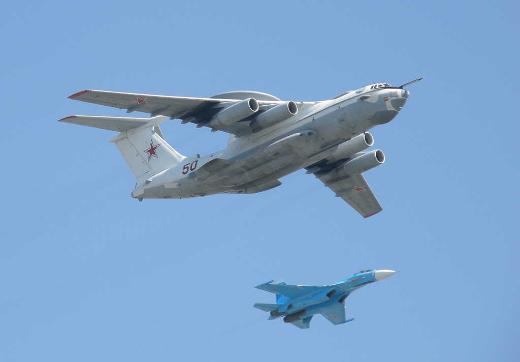 A Beriev A-50 flying with a Sukhoi Su-27 escort