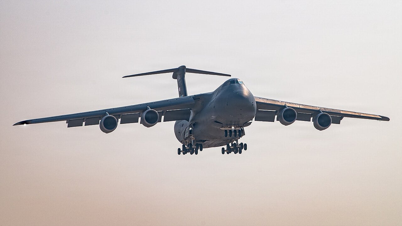A US Air Force C-5M Super Galaxy on final approach with its landing gear extended