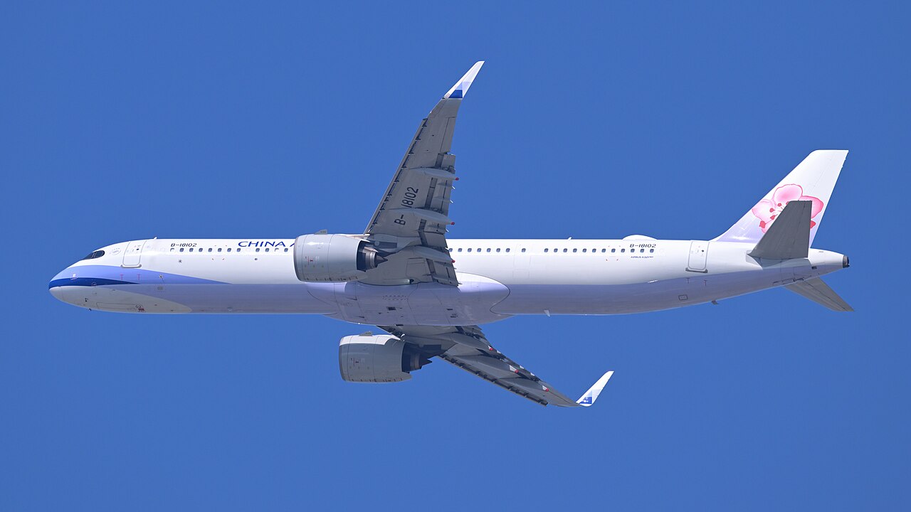An Airbus A321neo of China Airlines seen from below, showing the lower forward fuselage