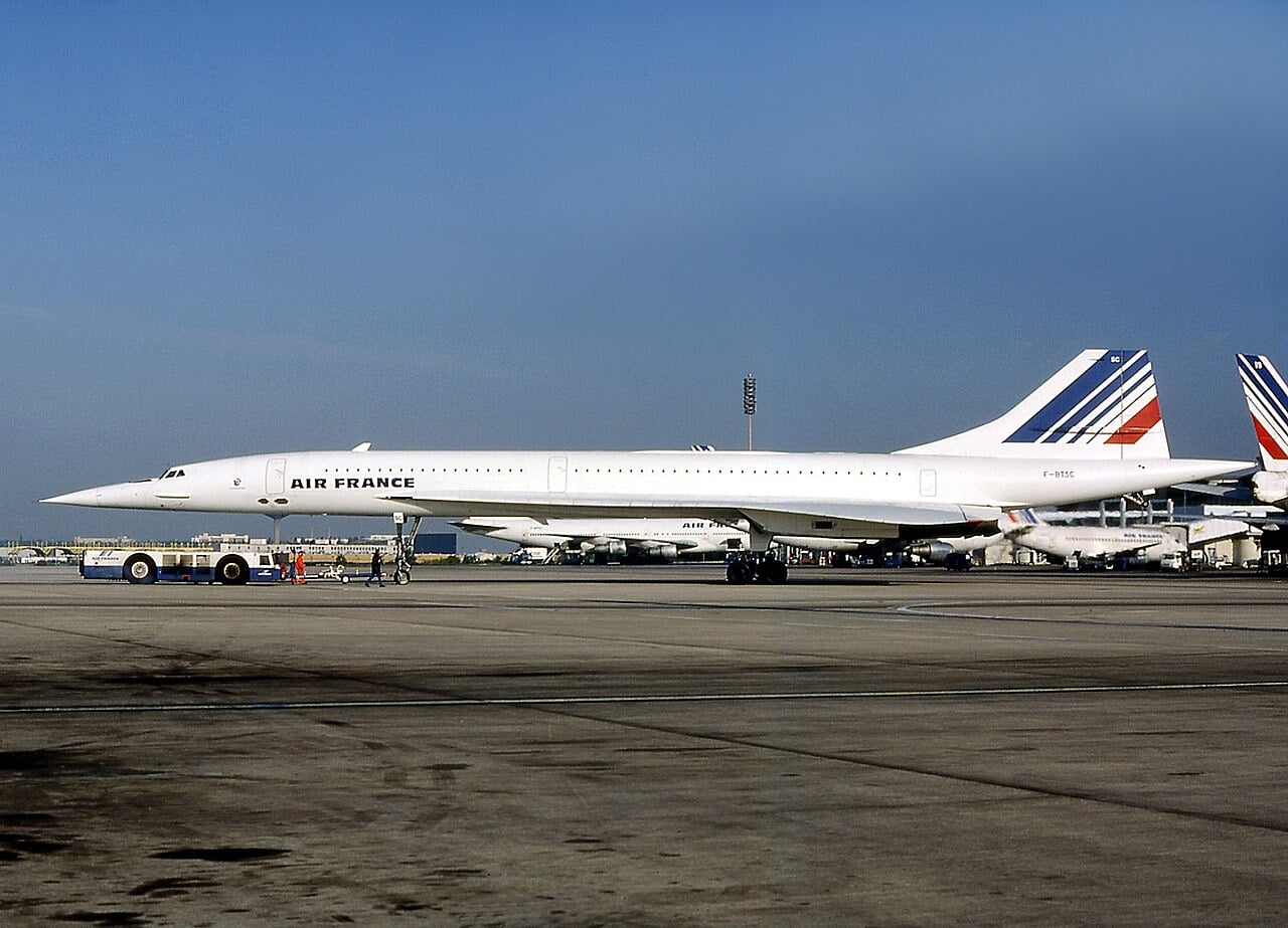 Air France Concorde F-BTSC parked at Paris Charles de Gaulle airport under a blue sky