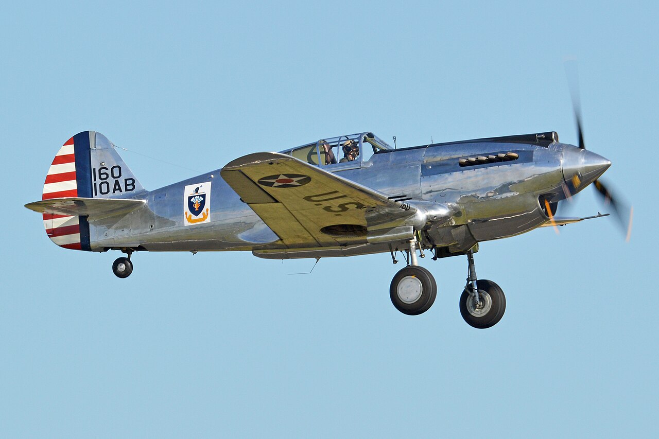 Curtiss P-40C Warhawk G-CIIO of The Fighter Collection taking off The Fighter Collection Curtiss P-40C Warhawk G-CIIO, US serial 41-13357, taking off at Duxford
