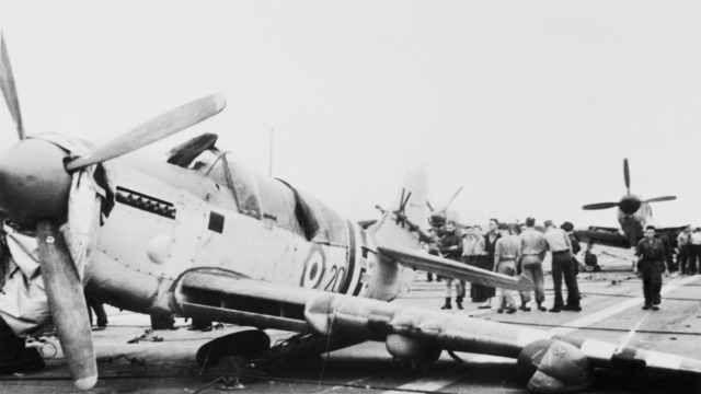 A damaged Fairey Firefly of No. 817 Squadron on the flight deck of HMAS Sydney in 1951