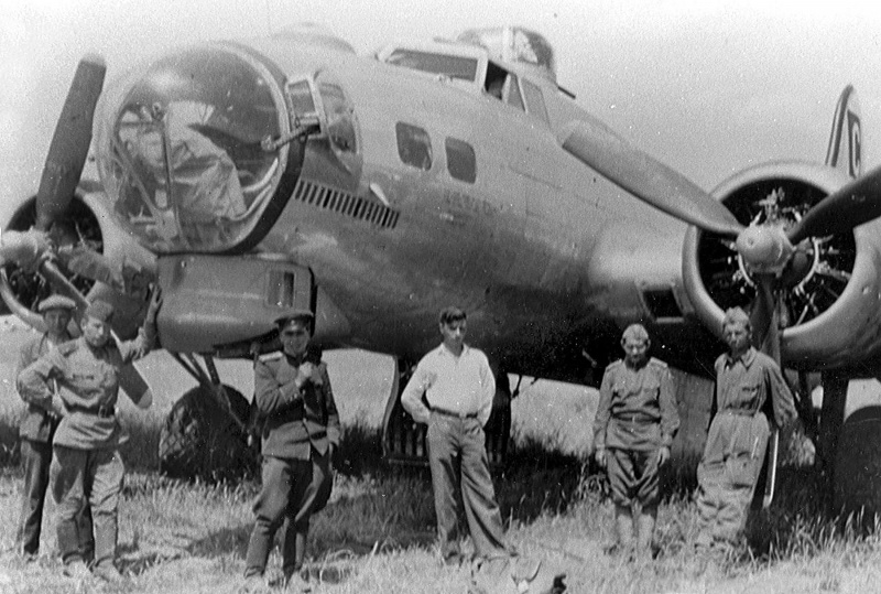 A badly damaged B-17 and Soviet soldiers at Poltava, 22 June 1944