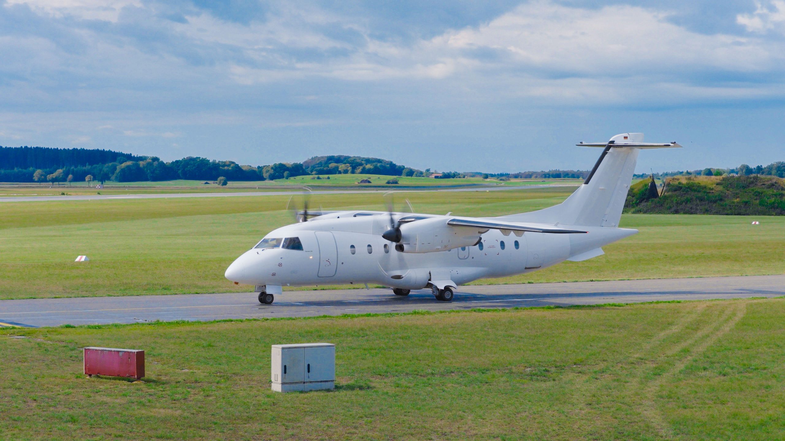 White Dornier 328 turboprop taxiing