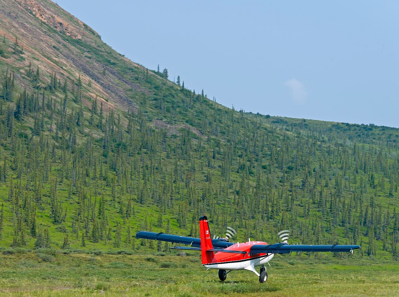Kenn Borek Air DHC-6 Twin Otter taking off from a gravel strip in Ivvavik National Park
