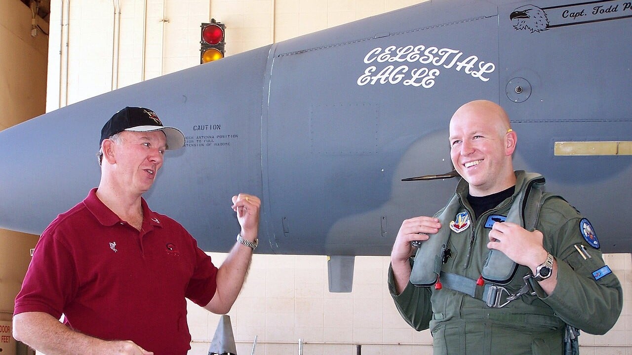 Retired Major General Doug Pearson and Captain Todd Pearson standing in front of F-15A 76-0084