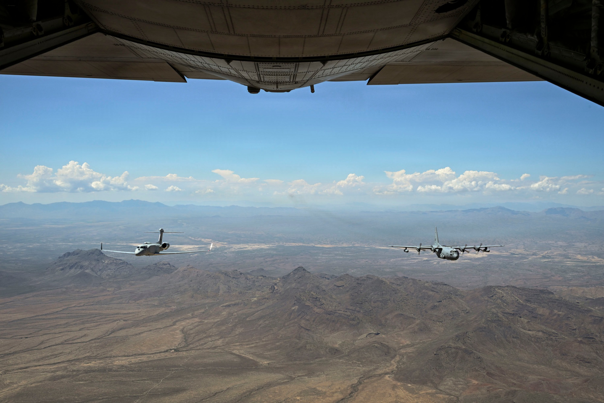 EC-130H Compass Call and EA-37B Compass Call in formation over southern Arizona