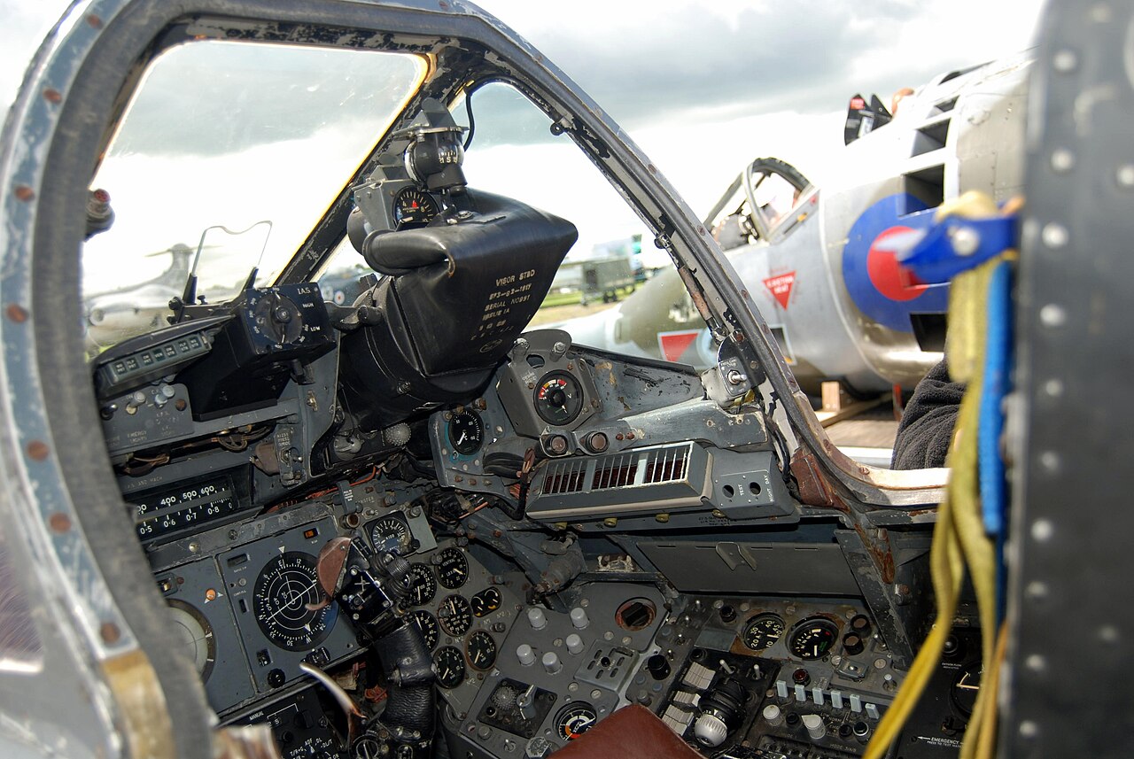 The dense instrument panel and side consoles of an English Electric Lightning cockpit