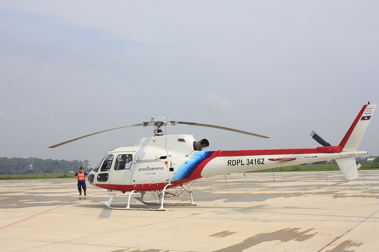 A Eurocopter AS350 B2 helicopter parked on a ramp
