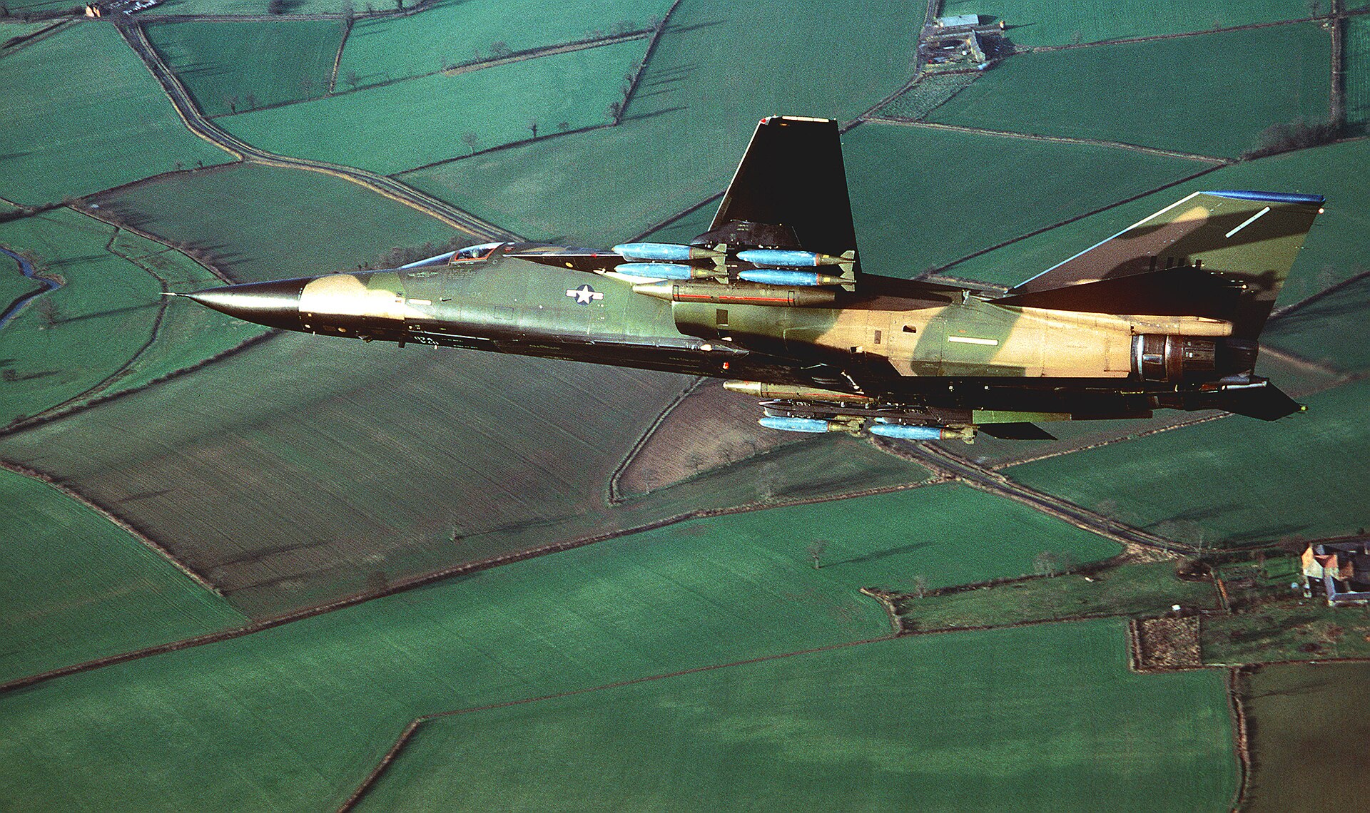 Underside view of an F-111 of the 20th Tactical Fighter Wing carrying bombs