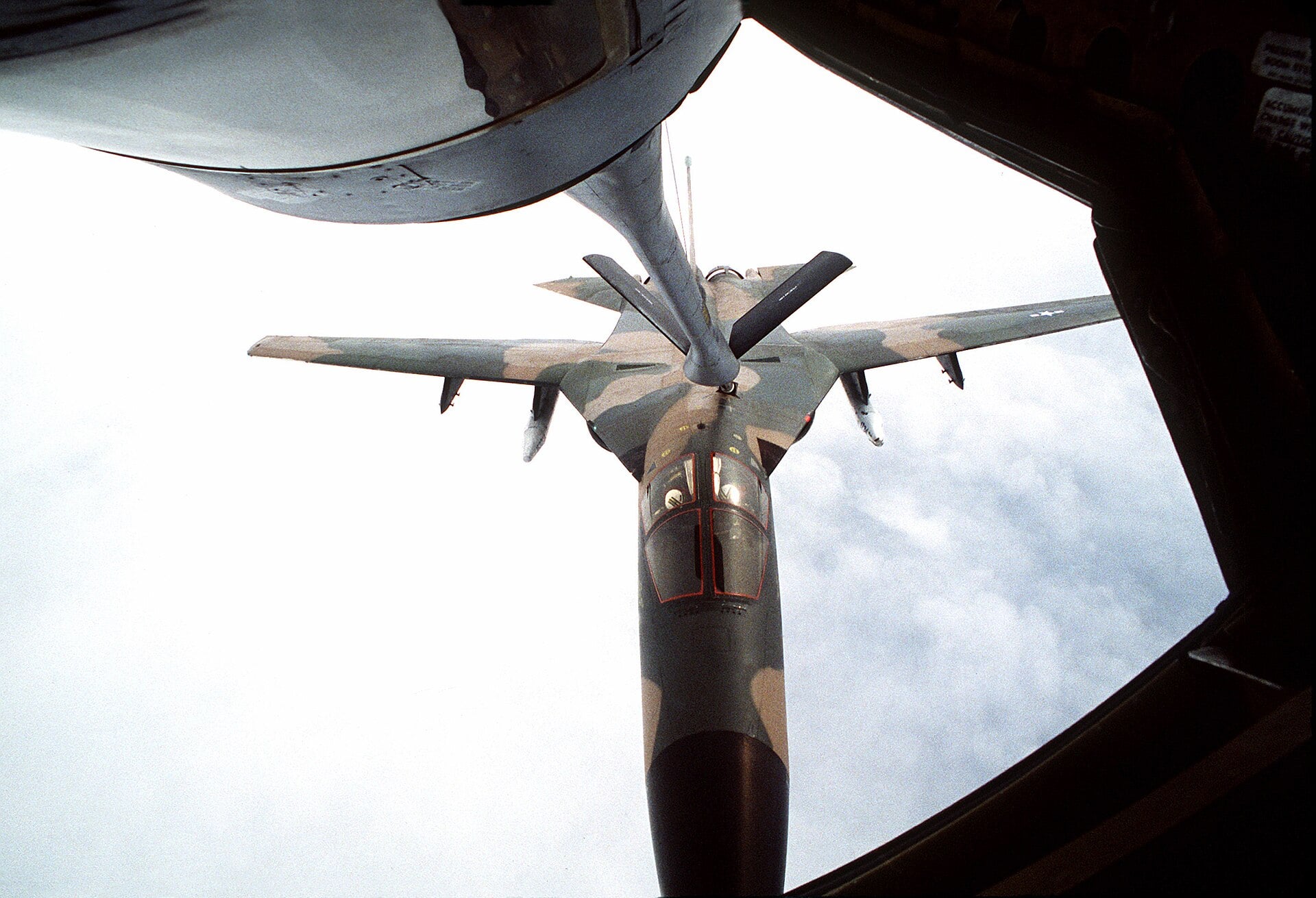 An F-111 in contact with a KC-135 Stratotanker refuelling boom, seen from the boom operator position