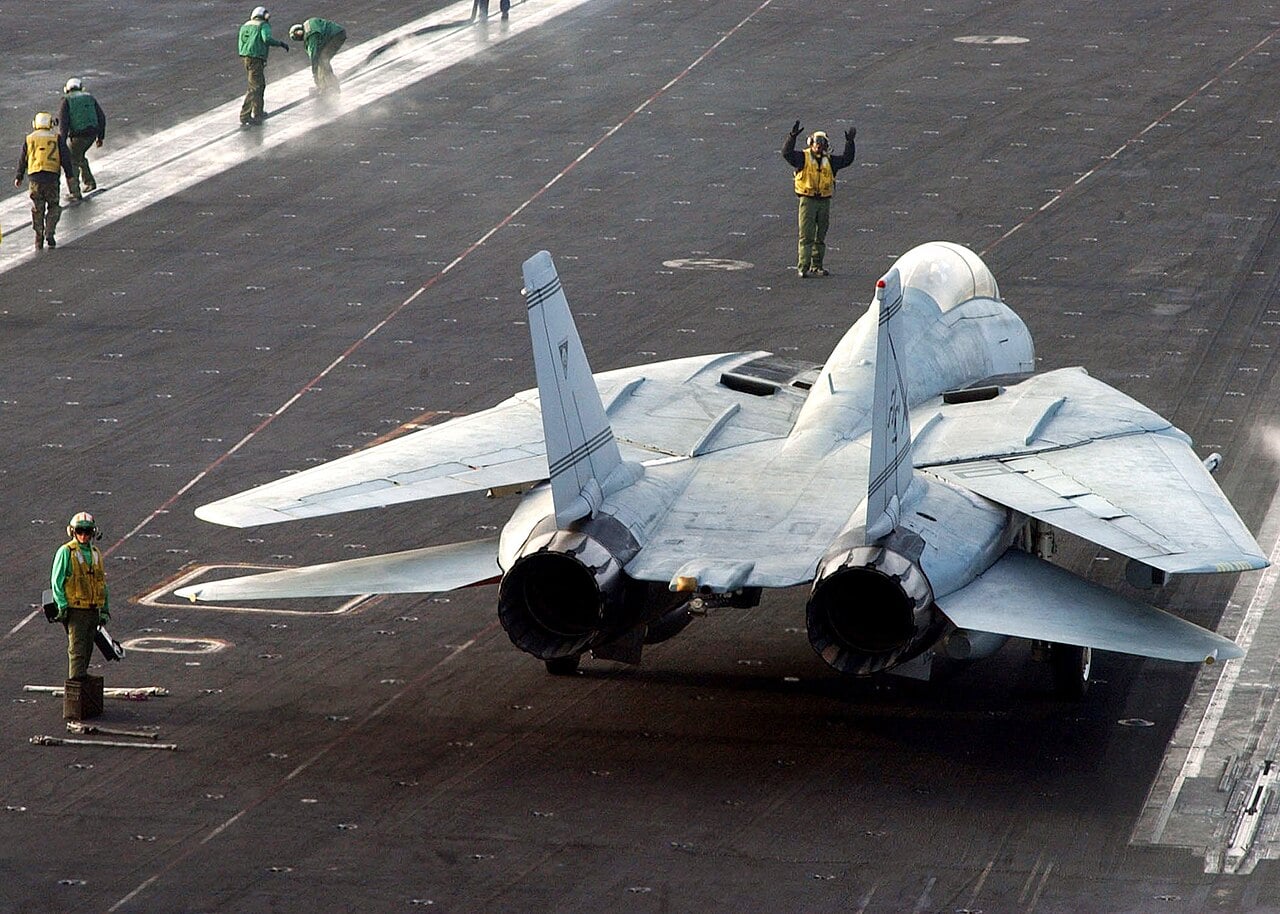 F-14 Tomcat on a carrier deck with wings in the oversweep position